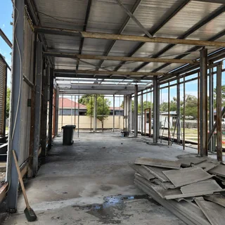 Commercial building interior mid strip out with panels removed