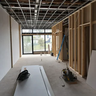 Tradesmen fitting out the interior of a new retail shop space