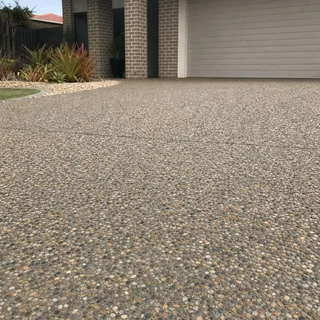 Close view of an exposed aggregate concrete driveway surface