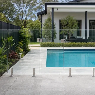 Frameless glass pool fence with stainless steel spigots